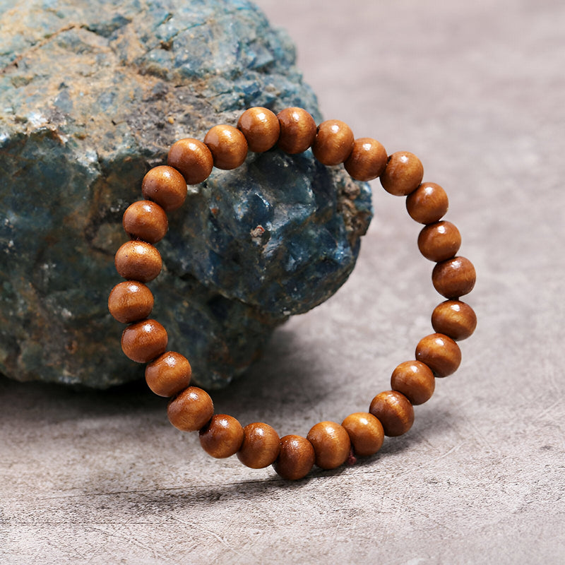 Bracelet mixte en perles de bois marron lisse, finition naturelle, style décontracté.