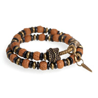 Bracelet femme en perles de Rudraksha marron et bois d’ébène noir avec breloque cuivre.