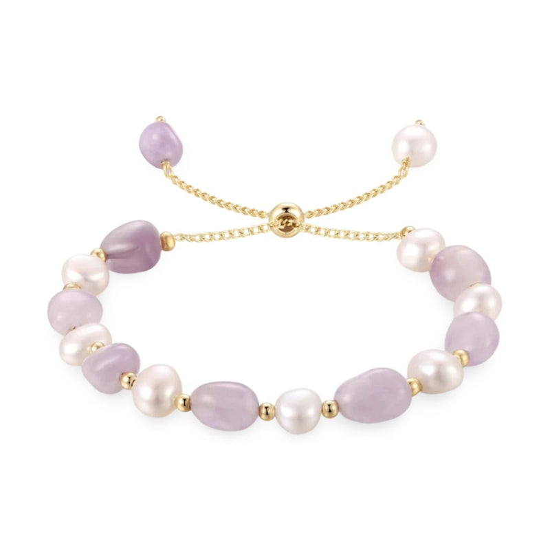 Bracelet ajustable en perles d'eau douce lavande et blanches avec petits intercalaires dorés.