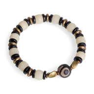 Bracelet femme perles blanches d'os de yak et bois d'ébène noir avec détail cuivre circular.