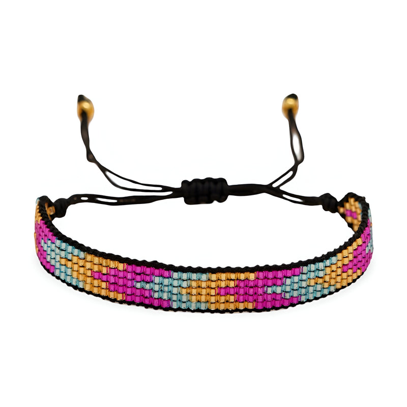 Bracelet ajustable avec perles japonaises colorées rose, bleu, jaune et noir, motif géométrique.