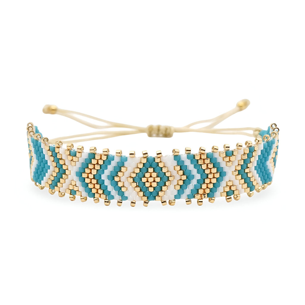 Bracelet bleu ajustable en perles du Japon arrondies avec motif géométrique et détails dorés.