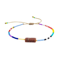 Bracelet ajustable en perles Miyuki multicolores avec pierre naturelle jaspe rouge au centre.