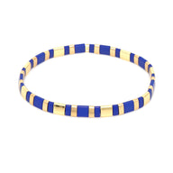 Bracelet fin en perles bleues et dorées alternées, style moderne et élégant pour femme.