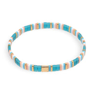 Bracelet femme perles bleues, blanches et dorées en style géométrique Kanna.