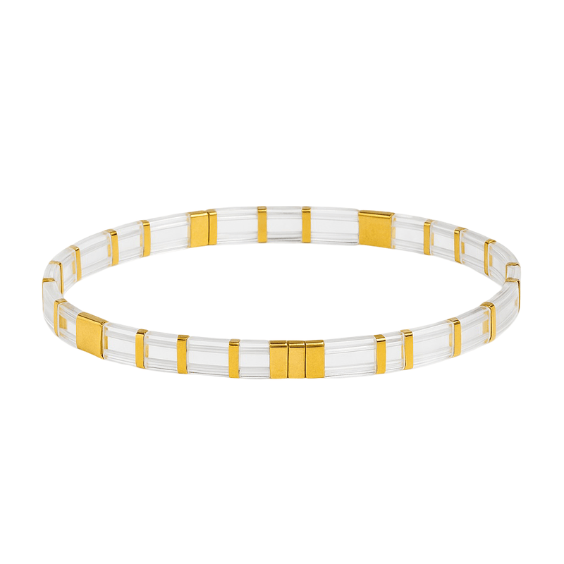 Bracelet fin transparent en perles japonaises avec sections dorées, style minimaliste pour femme.