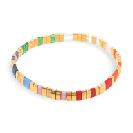 Bracelet femme perles plates multicolores style japonais avec finition dorée.