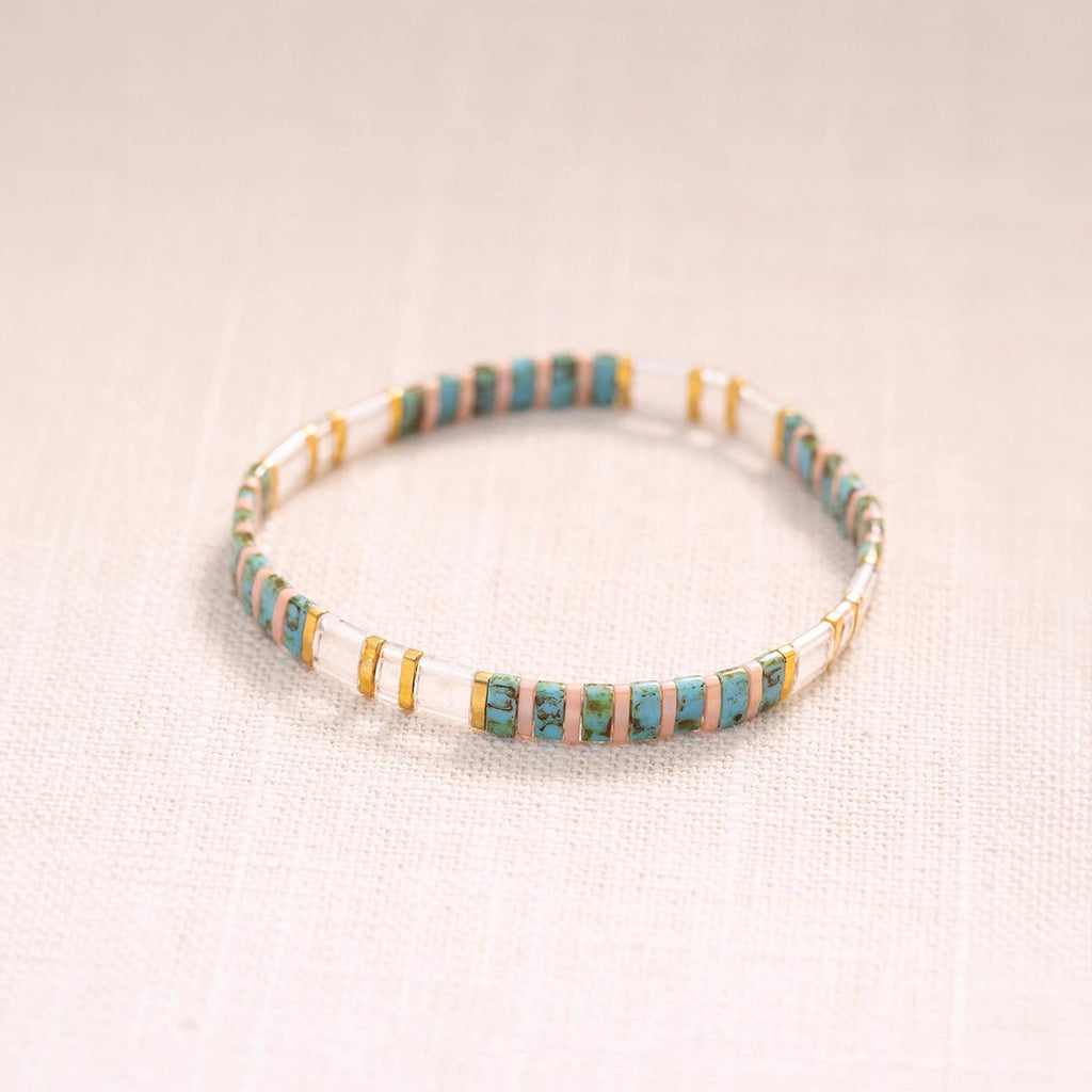 Bracelet fin pour femme en perles japonaises bleu transparent et doré, style Neyali.