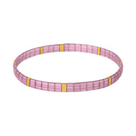 Bracelet femme en perles japonaises roses avec sections dorées fines et design minimaliste.