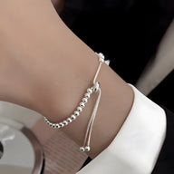 Bracelet femme en argent sterling avec perles arrondies et chaîne réglable élégante.