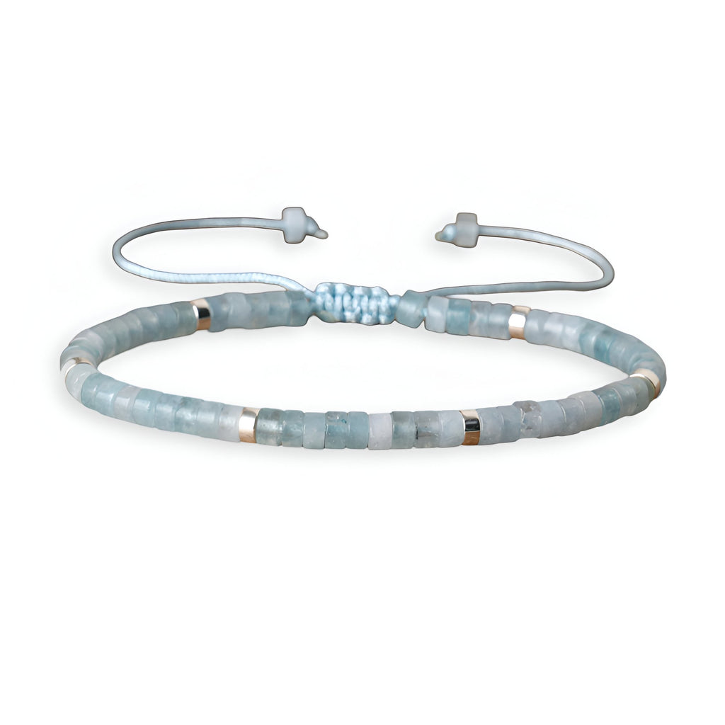 Bracelet mixte perles heishi en aigue-marine bleu clair avec fermoir ajustable en coton tressé.