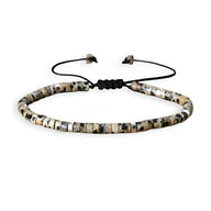 Bracelet mixte perles heishi jaspe dalmatien blanc beige noir cordon noir ajustable.