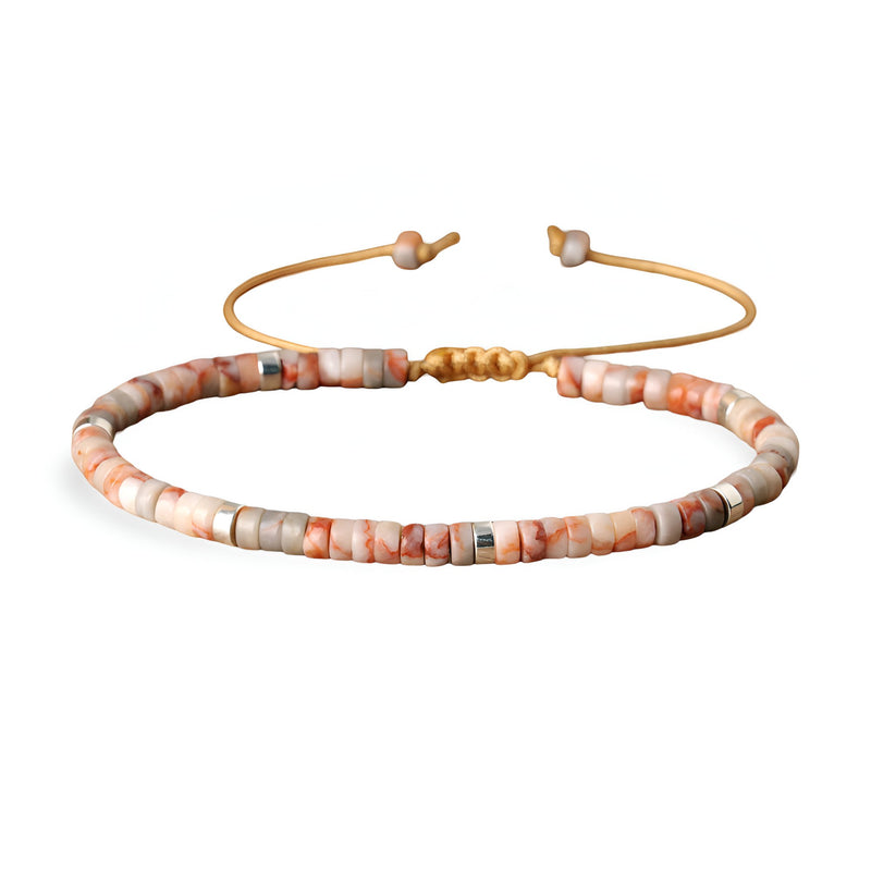 Bracelet mixte en perles heishi jaspe impérial rose avec fermoir doré ajustable.