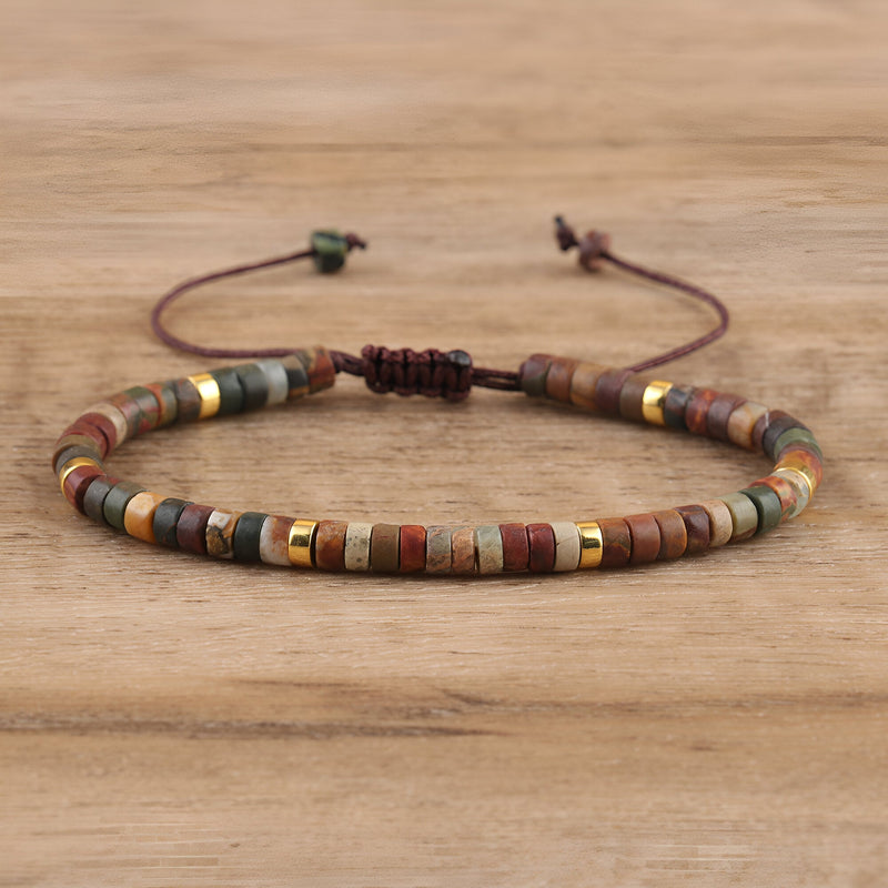 Bracelet mixte en perles heishi jaspe marron avec accents dorés et cordon ajustable marron.