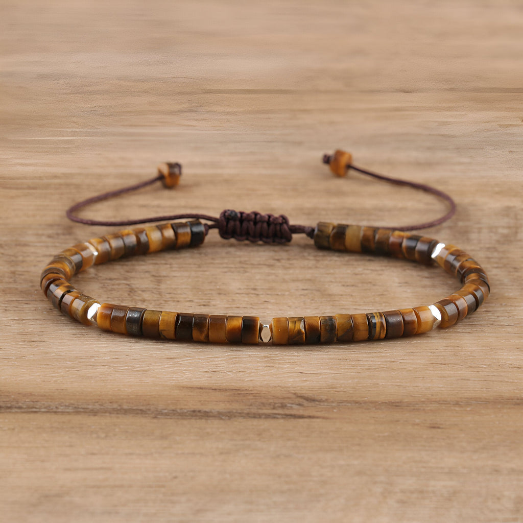 Bracelet mixte en perles heishi en oeil de tigre marron avec fermeture réglable en corde.