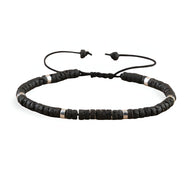 Bracelet mixte en perles heishi noires et pierre volcanique avec lien réglable.