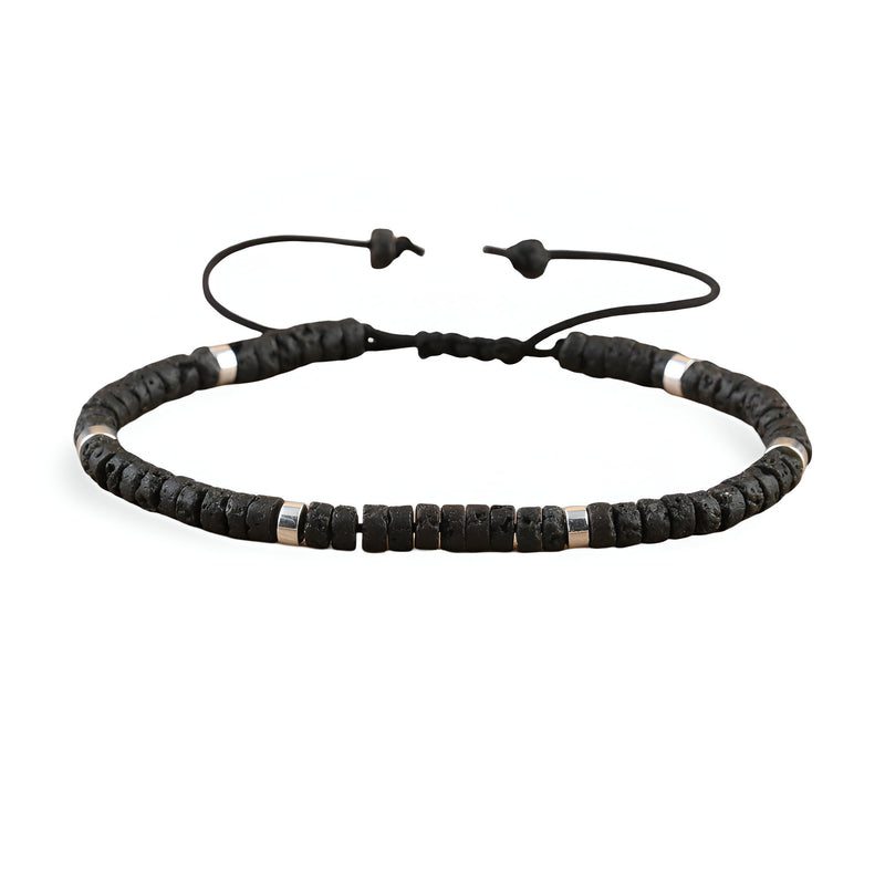 Bracelet mixte en perles heishi noires et pierre volcanique avec lien réglable.