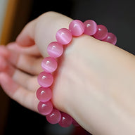 Bracelet mixte en pierres naturelles rose vif, perles rondes lisses et brillantes.