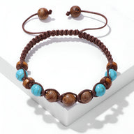 Bracelet mixte réglable en perles de bois et pierre turquoise, cordon marron tressé.
