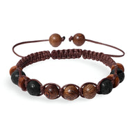 Bracelet mixte en bois et pierres naturelles noires sur cordon marron tressé ajustable.