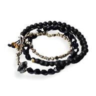 Bracelet homme en pierres noires avec ornement spartiate en métal argenté, style enfilade multiple.