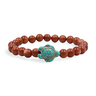 Bracelet mixte en perles marron avec tortue turquoise centrale en pierre naturelle.