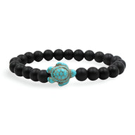 Bracelet mixte en perles noires matte avec tortue turquoise centrale en pierre naturelle.
