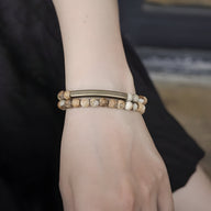 Bracelet mixte en pierres volcaniques claires et cuivre, perles rondes marron clair, modèle Vilk.