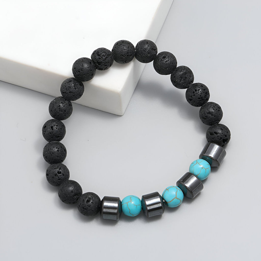 Bracelet homme perles noires en pierre volcanique avec perles turquoise et métal argenté.