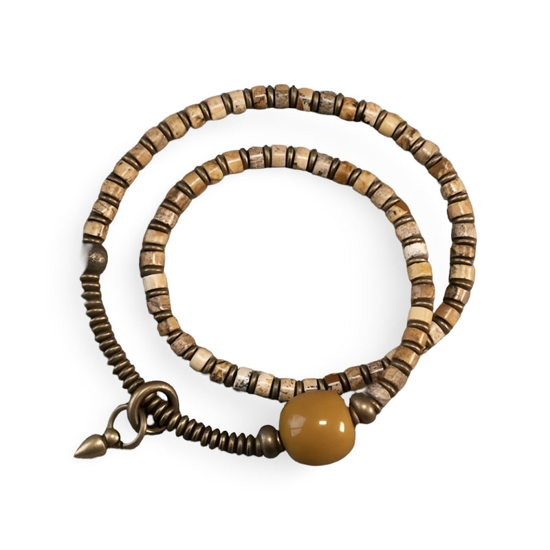 Bracelet femme en perles de jaspe jaune et agate avec éléments en cuivre et fermoir anneau ressort.