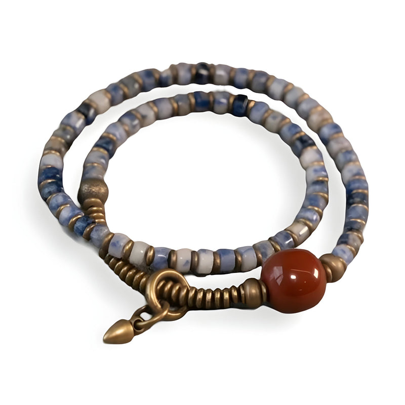 Bracelet femme en jaspe bleu et cuivre, perle rouge, fermoir torsadé élégant.