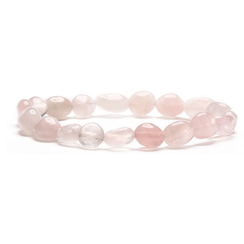 Bracelet asymétrique en pierres naturelles de quartz rose, perles irrégulières rosées translucides.