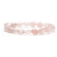 Bracelet asymétrique en pierres naturelles de quartz rose, perles irrégulières rosées translucides.
