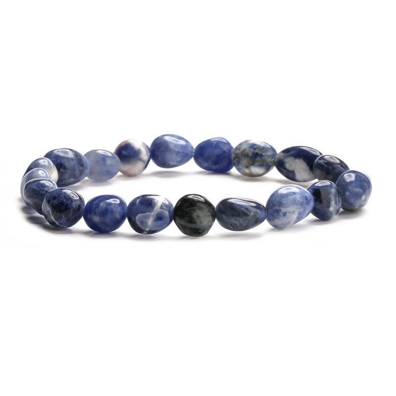 Bracelet asymétrique en pierres naturelles bleues et grises, style perles lisses polies.