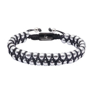 Bracelet double rang en pierres naturelles noires et gris argent, encordé style Tamal avec fermoir ajustable.
