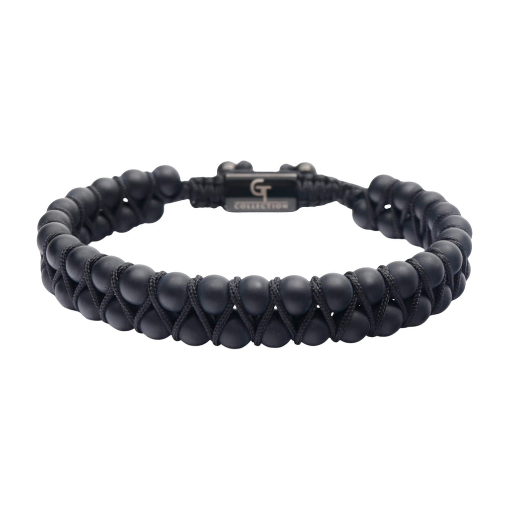 Bracelet double rang en pierres noires mates, encordé avec fermoir métallique noir gravé.