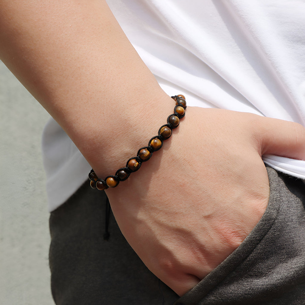 Bracelet mixte en œil de tigre, perles lisses entrelacées de corde noire ajustable.