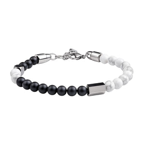 Bracelet perles naturelles noires et blanches 6 mm, acier inoxydable argenté, fermoir réglable.