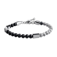Bracelet masculin avec perles noires mates et marbrées blanches, acier inoxydable argenté réglable.