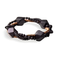 Bracelet femme en bois d'ébène noir et perles noires avec accent cuivre, design artisanal et moderne.