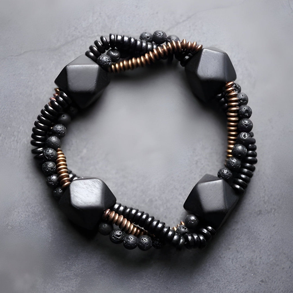 Bracelet femme en pierres naturelles noires et bois d'ébène noir avec perles cuivrées et noeud coulissant.