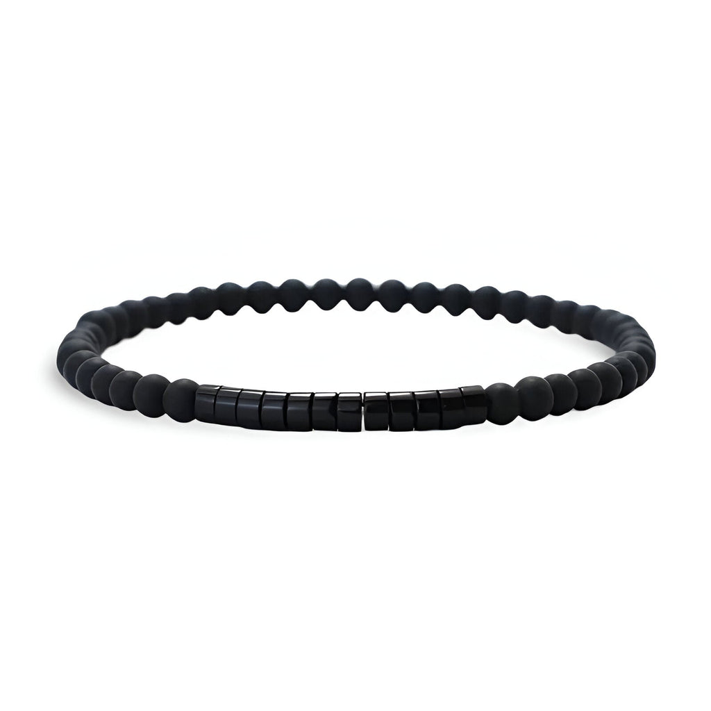 Bracelet fin pour homme en pierres naturelles noires mates avec perles cylindriques noires brillantes.