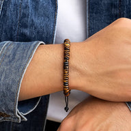 Bracelet ajustable en pierres d'œil de tigre aux tons marron et noir avec perles rondes lisses.