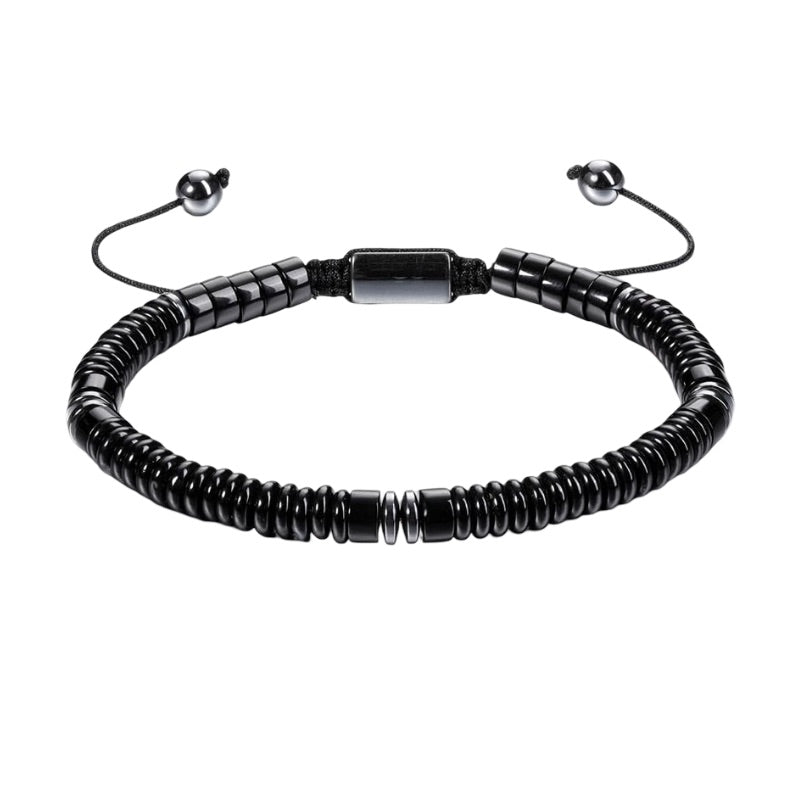 Bracelet ajustable noir en pierres naturelles fines, perles cylindriques mat et lustré, fermoir coulissant.