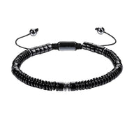 Bracelet ajustable noir en pierres naturelles fines, perles cylindriques mat et lustré, fermoir coulissant.