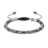 Bracelet ajustable en agate grise avec perles rondes plates et fermoir noir brillant.