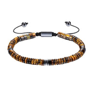 Bracelet ajustable en perles d'œil de tigre rondes et cylindriques avec fermoir coulissant noir.