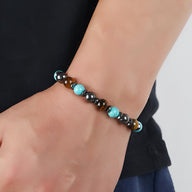 Bracelet mixte en pierres naturelles avec perles oeil de tigre marron et turquoise bleue, style moderne.
