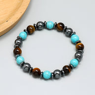Bracelet mixte en pierres naturelles avec perles turquoise, œil de tigre marron et hématite noire brillante.