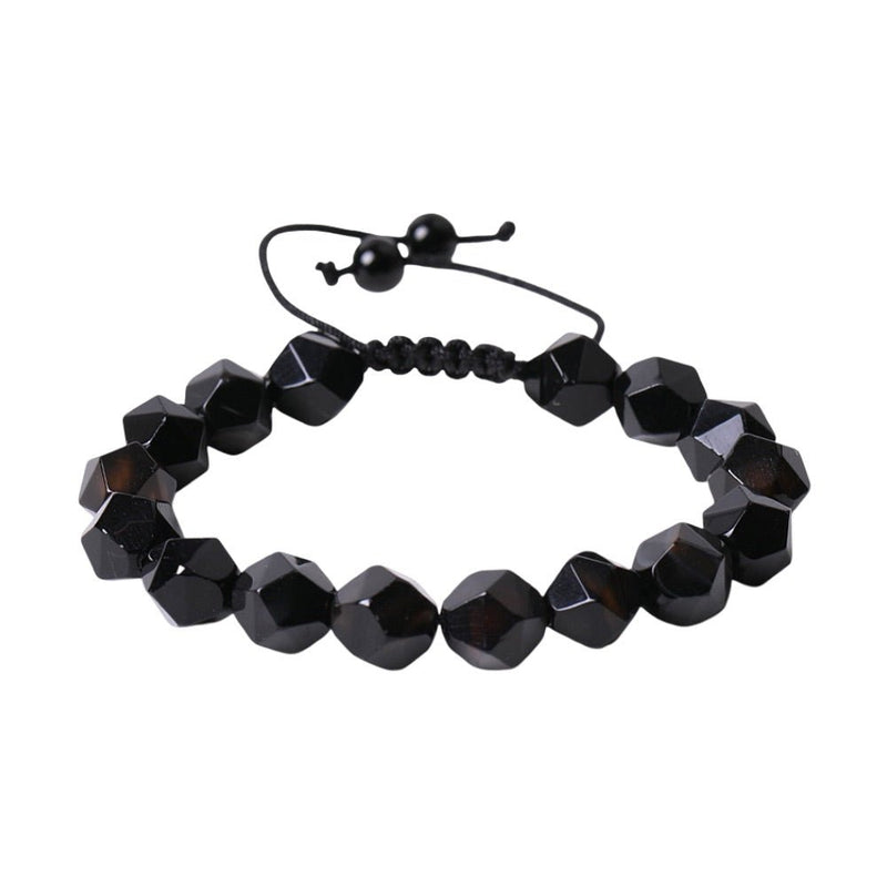 Bracelet réglable en pierres noires taillées, finition brillante, style moderne et élégant.